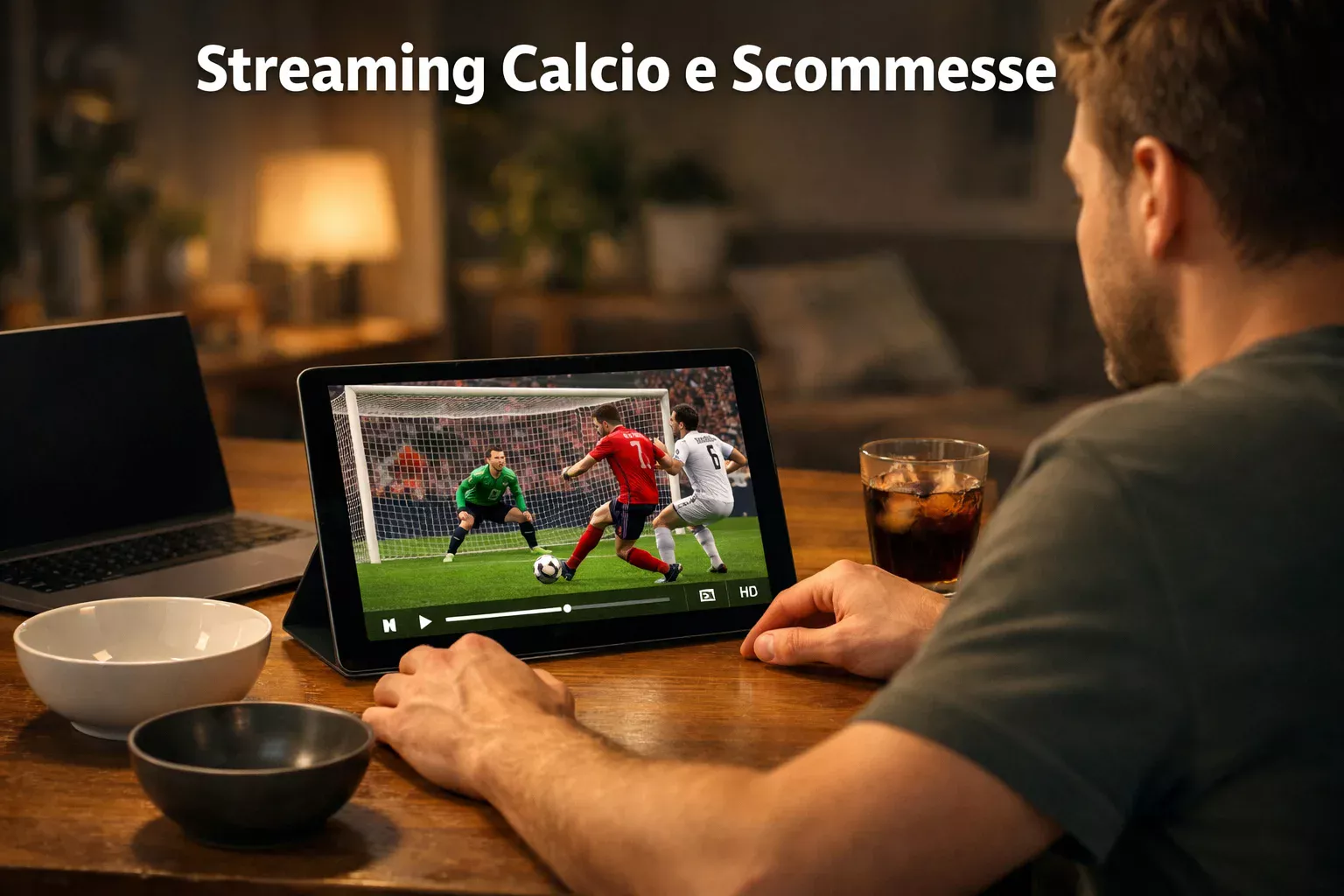 Persona che guarda una partita di calcio in streaming su tablet